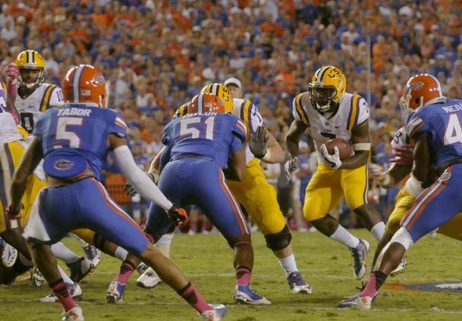 LSU freshman running back Leonard Fournette (7) runs the ball Saturday, October 11, 2014 during the Tigers' 30-27 victory in Ben Hill Griffin Stadium.