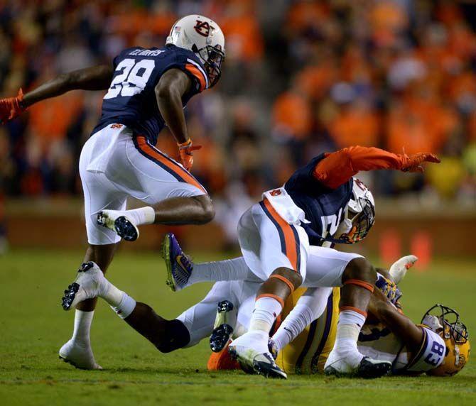 LSU sophomore wide receiver Travin Dural (83) is tackled by several members of Auburn's defense Saturday, October 4, 2014 during the LSU Tigers' 41-7 loss against the Auburn Tigers in Jordan-Hare Stadium.