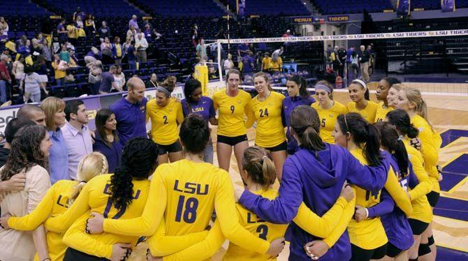 LSU volleyball team celebrates their first home win during Tiger's victory 3-2 against Arkansas Sunday, October 5, 2014 in the PMAC.