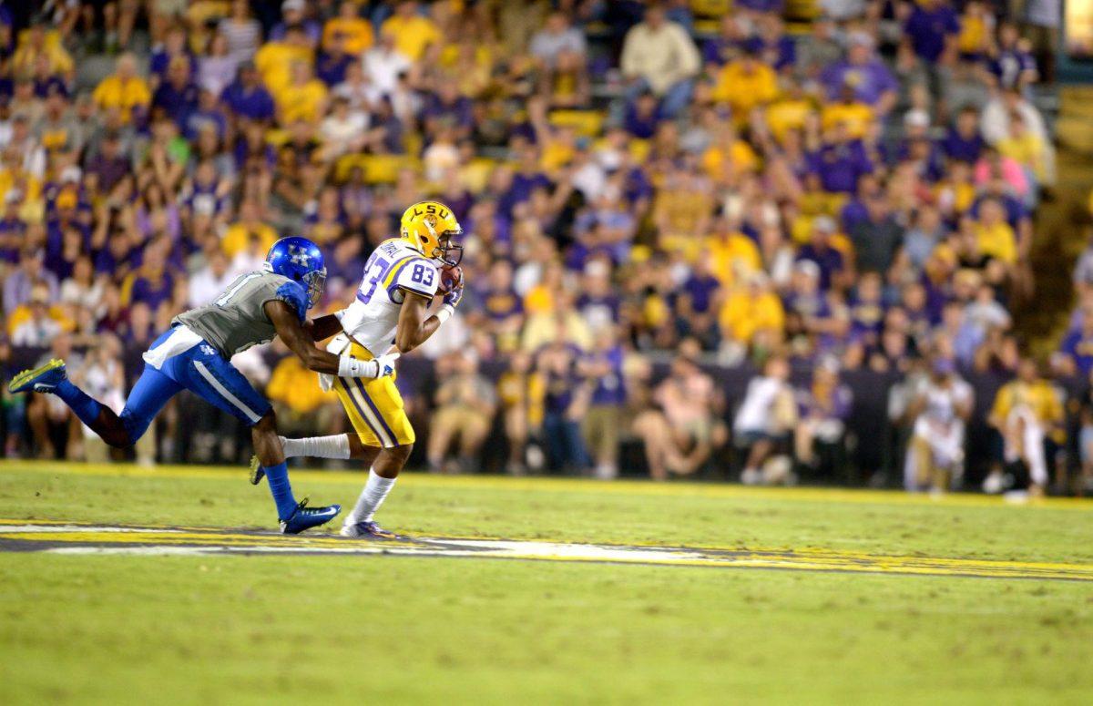 Sophomore wide receiver Travin Dural (83) breaks a tackle during the Tigers' 42-3 victory against Kentucky on Saturday, October 18th, 2014.