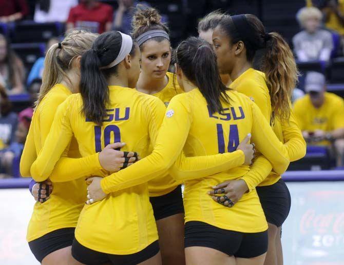 LSU Volleyball team huddle during Tiger's 3-2 victory against Arkansas Sunday, October 5, 2014 in the PMAC.