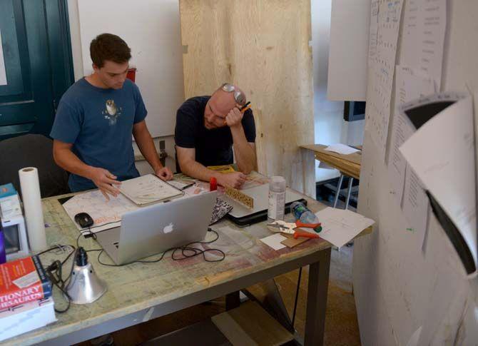 LSU architecture senior Matthew Kenney and professor William Doran discuss plans for an exhibit curated by the Fall 2014 Mid City Studio class.