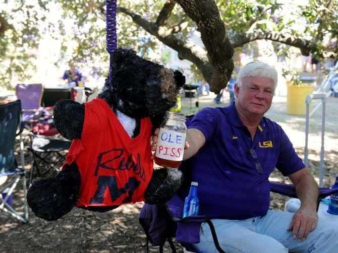 A stuffed bear donning an Ole Miss jersey hangs from a tree on the Parade Grounds before the Homecoming Game Saturday, October 25, 2014.