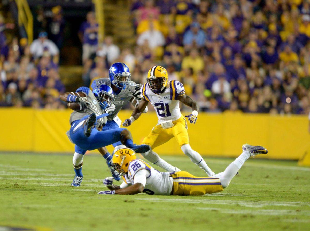 Senior safety Ronald Martin (26) makes a tackle during the Tigers' 42-3 victory against Kentucky on Saturday, October 18th, 2014.