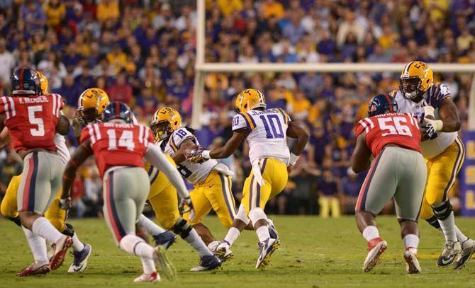 LSU sophomore Quarterback Anthony Jennings (10) fakes a hand off during Tigers' 10-7 victory against Ole Miss Saturday, October 25, 2014 in Tiger Stadium