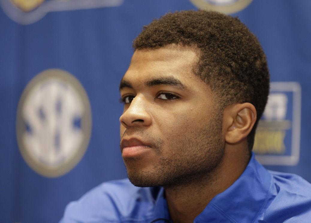 Kentucky's Andrew Harrison answers a question during a news conference at the Southeastern Conference NCAA men's college basketball media day in Charlotte, N.C., Wednesday, Oct. 22, 2014. (AP Photo/Chuck Burton)