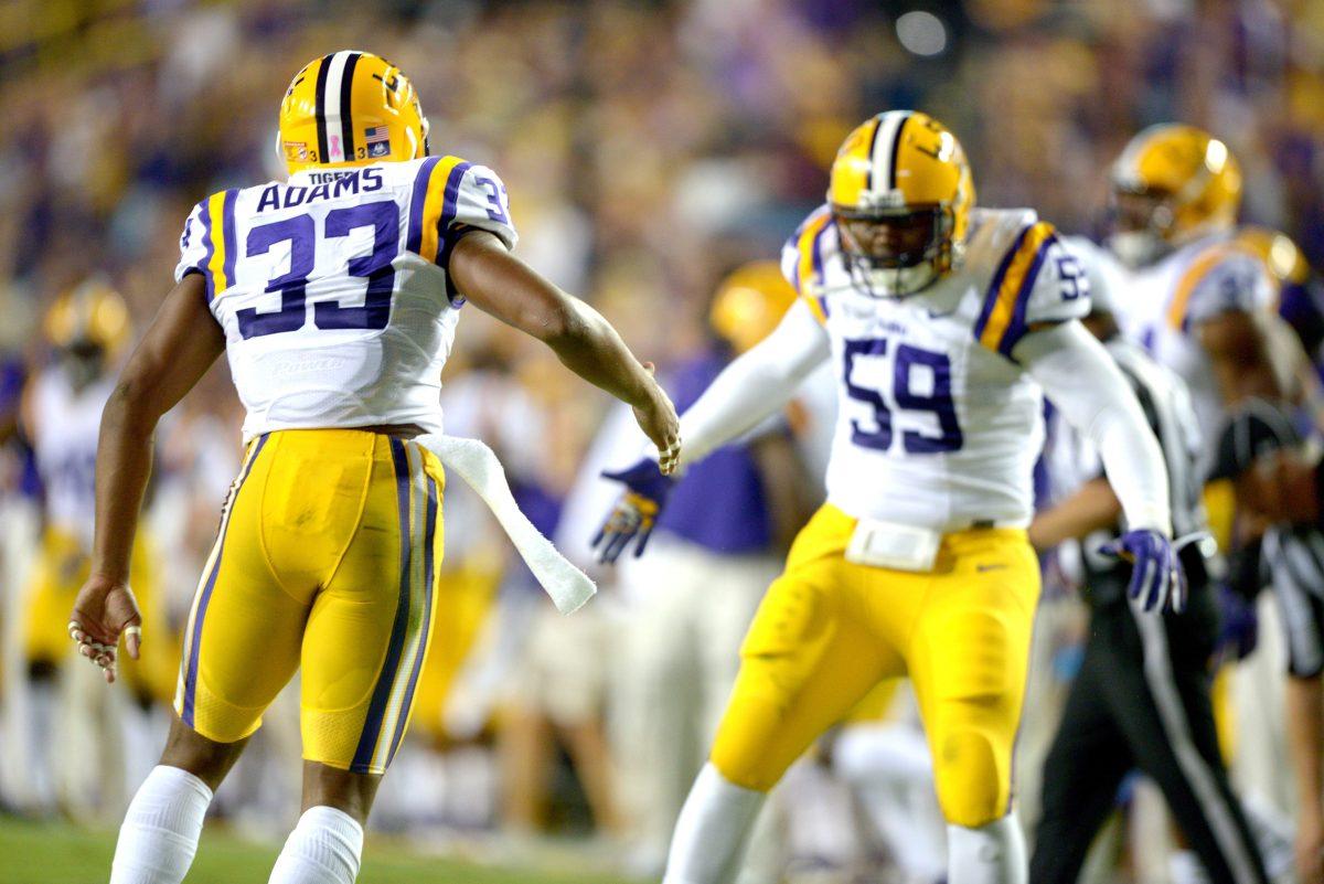 Freshman safety Jamal Adams (33) and senior defensive end Jermauria Rasco (59) celebrate during the Tigers' 42-3 victory against Kentucky on Saturday, October 18th, 2014.