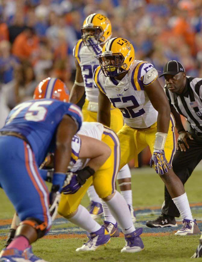 LSU sophomore Kendell Beckwith (52) prepares for a defensive play Saturday, October 11, 2014 during the Tigers' 30-27 victory in Ben Hill Griffin Stadium.