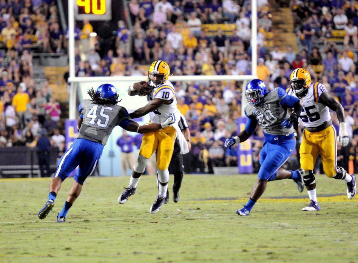 Sophomore quarterback Anthony Jennings (10) breaks a tackle during the Tigers' 42-3 victory against Kentucky on Saturday, October 18th, 2014.