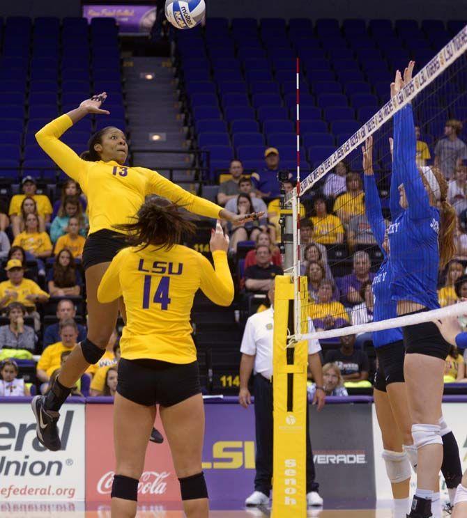 LSU sophomore middle blocker Briana Holman (13) jumps to spike the ball during the loss aginst Kentucky Wednesday, September 24, 2014 in the PMAC.