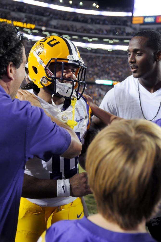 LSU senior runningback Terrance Magee (18) is congratualated by fans after a 10-7 win against Ole Miss in Tiger Stadium Saturday, October 25, 2014.