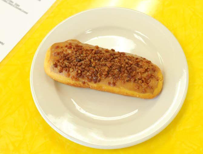 Mr. Ronnie's Famous Hot Donuts offers a bacon eclair- a donut filled with bavarian cream and topped with maple syrup and bacon bits.