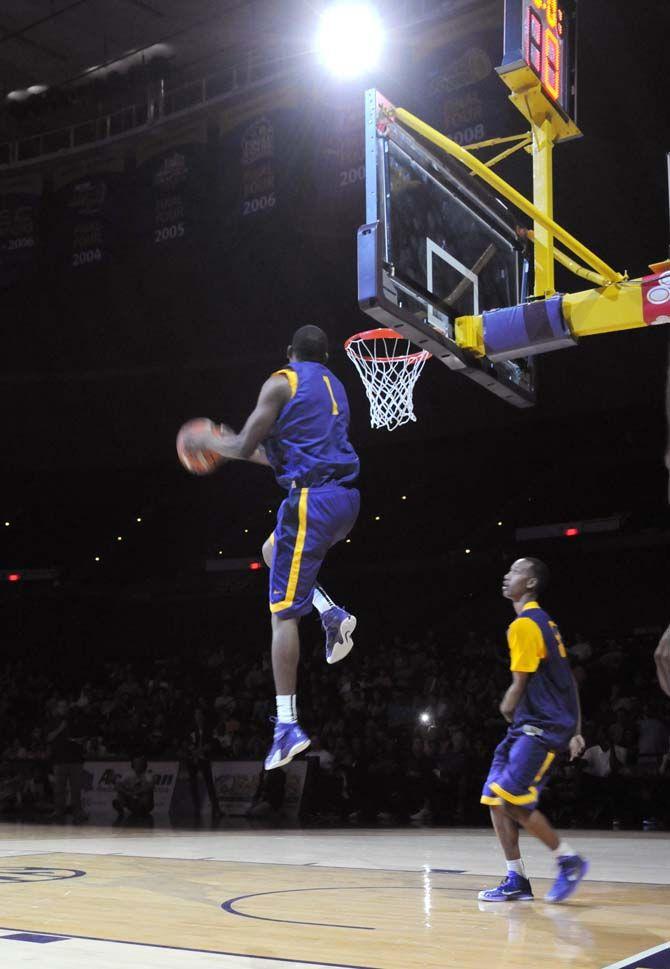 LSU men's basketball sophomore forward, Jarell Martin (1), participates in the dunking contest at Basketball Bayou Madness in the PMAC on Friday, October 17.