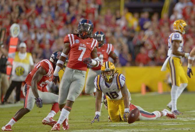LSU senior running back Terrence Magee (18) looks at the ball after being tackled during the Tigers' victory 10-7 over Ole Miss Saturday, October 25, 2014 in LSU Tiger Stadium.