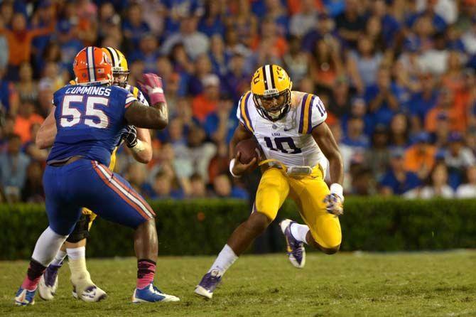 LSU sophomore quarterback Anthony Jennings (10) runs the ball Saturday, October 11, 2014 during the Tigers' 30-27 victory in Ben Hill Griffin Stadium.