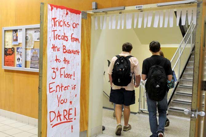 Students head to the basement of Middleton during the Halloween themed Library Open House Wednesday, October 29, 2014.