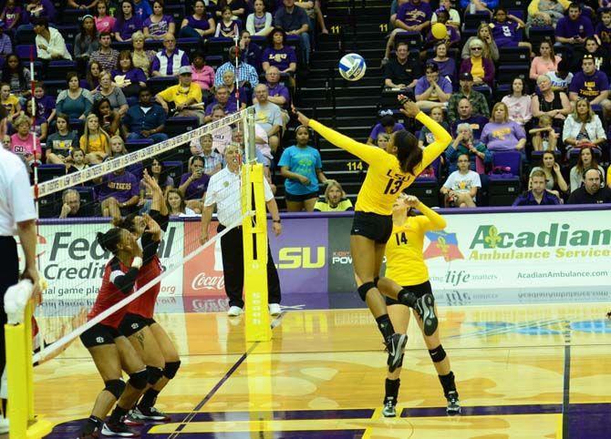 LSU's Women's Volleyball player Briana Holman (13) returns the ball in LSU vs Geogia at the PMAC on October 26, 2014.