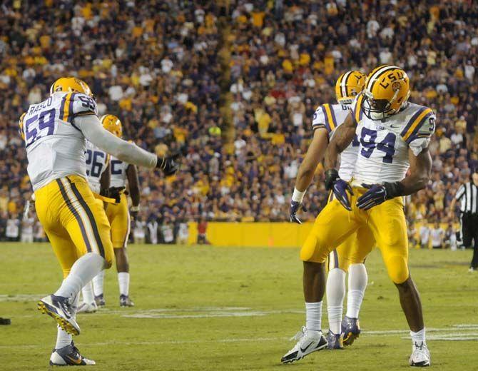 LSU senior defensive end Jermauria Rasco (59) and junior defensive end Danielle Hunter (94) celebrate during the Tigers' victory 10-7 over Ole Miss Saturday, October 25, 2014 in LSU Tiger Stadium.