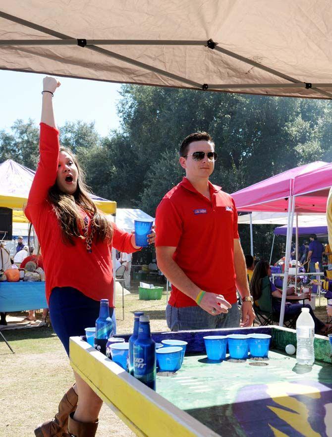 A girl cheers during a game of beer pong on the Parade Grounds Saturday, October 25, 2014.