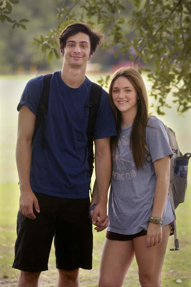 Business management sophomore Dillon Breaux and Psychology Junior Blake Constant hold hands on the parade grounds.