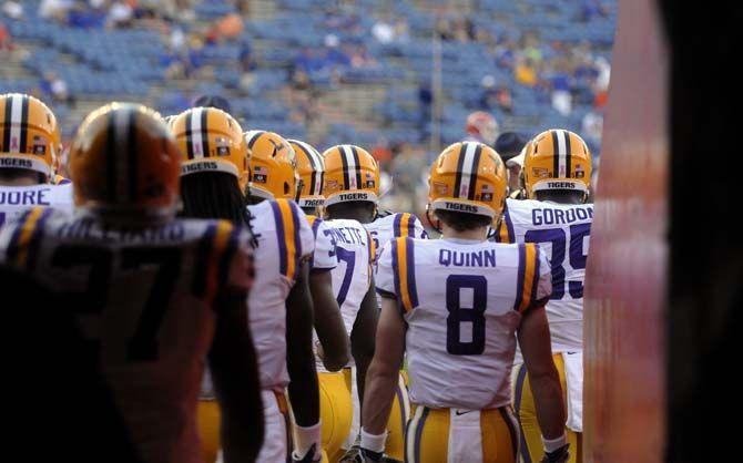 LSU football players walk out of the tunel during Tigers' 30-27 victory against Florida Saturday, October 11, 2014 in Ben Hill Griffin Stadium.