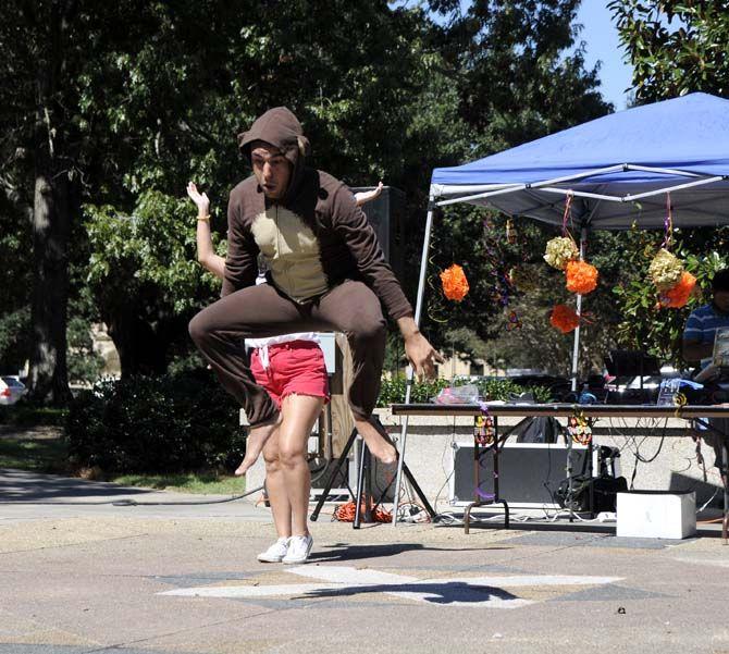 Jose Lloveras-Fuentes, a Theater Senior, participates in a flash mob with HSCS Tuesday at Free Speech Plaza.