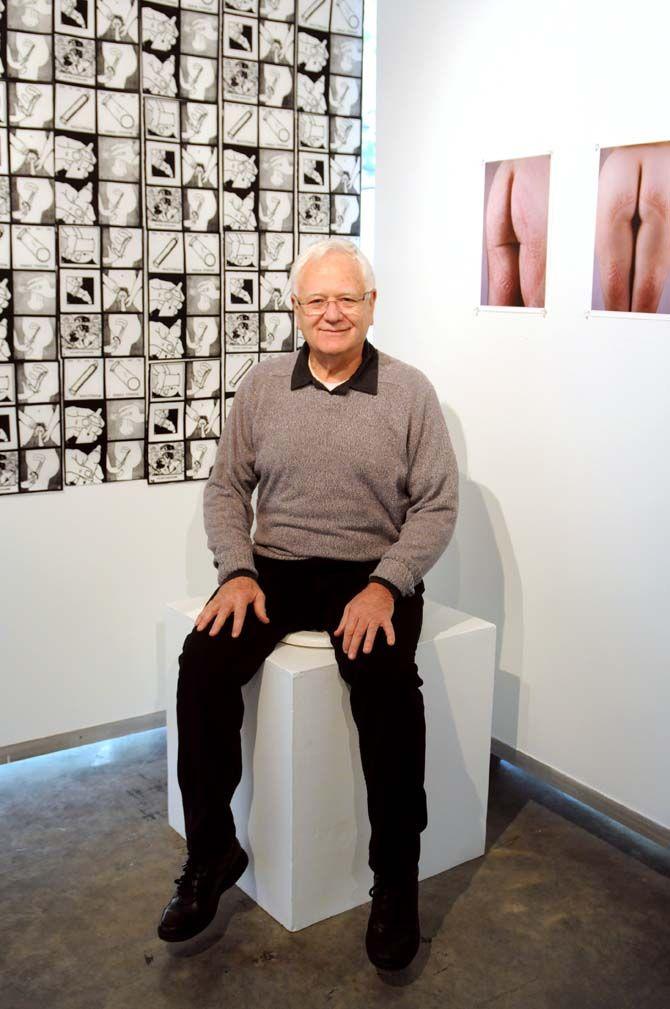 Dr. Eric Avery sits on his interactive piece being shown at his exhibit in Glassel Gallery.