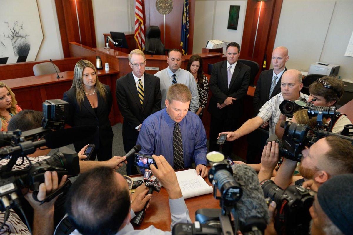 Former West Valley City police officer Shaun Cowley reads a statement to the media after Judge L.A. Dever dismissed a manslaughter charge against Crowley, Thursday, Oct. 9, 2014 in Salt Lake City. Cowley was charged with second-degree felony manslaughter in connection with the Nov. 2, 2012 fatal shooting of 21-year-old Danielle Willard. (AP Photo/The Salt Lake Tribune, Francisco Kjolseth, Pool)