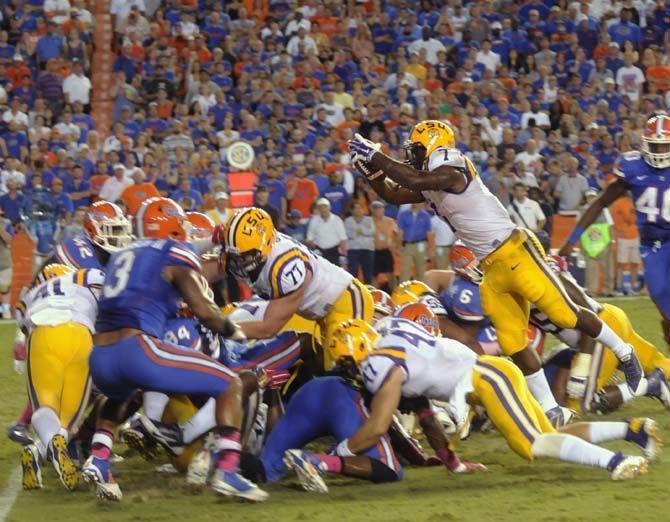 LSU freshman running back Leonard Fournette (7) scores a touchdown Saturday, October 11, 2014 during the Tigers' 30-27 victory in Ben Hill Griffin Stadium.