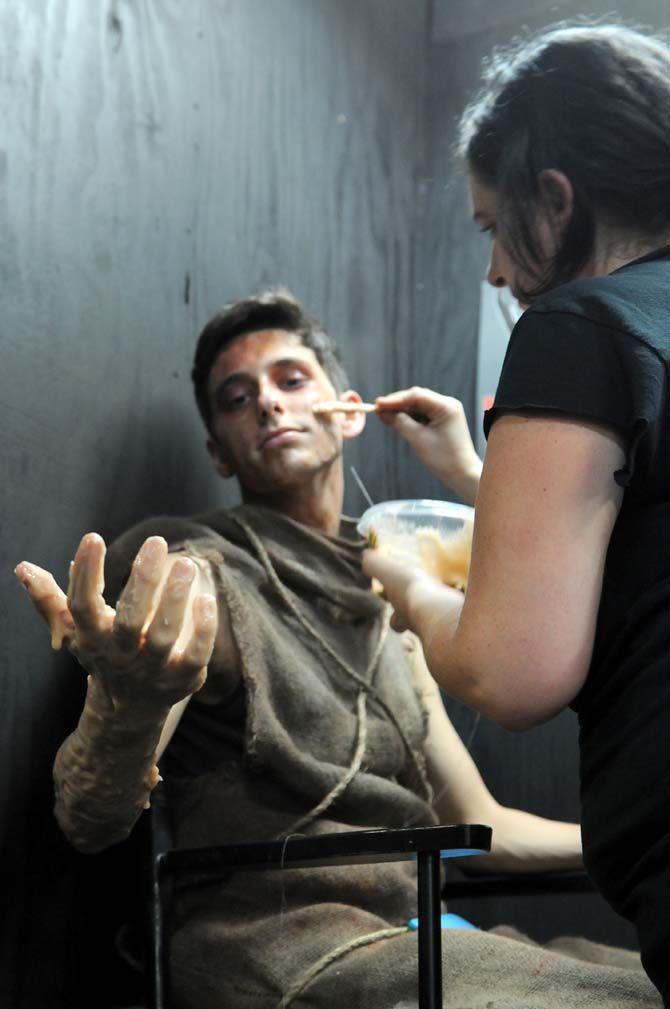 Makeup artists apply various materials on actors in the 13th Gate to give them a more frightening appearance.