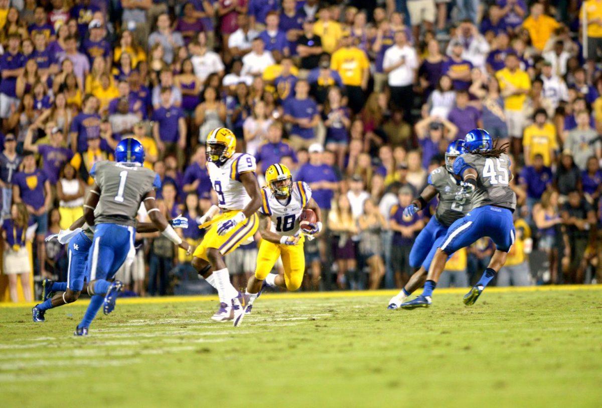 Senior running back Terrence Magee (18) runs for a gain during the Tigers' 42-3 win against Kentucky on Saturday, October 18th, 2014.