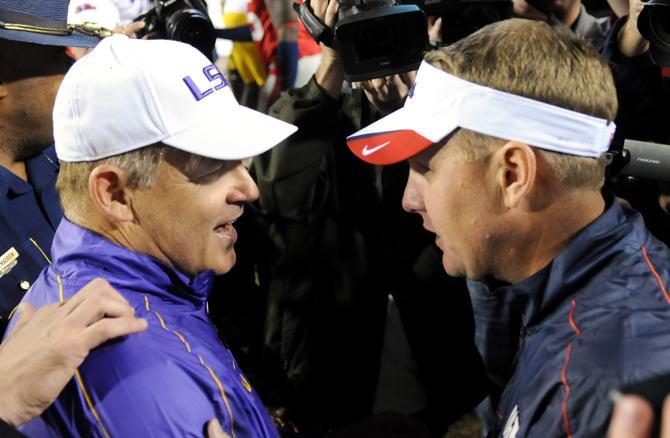 LSU head coach Les Miles shakes Ole Miss head coach Hugh Freeze's hand on Saturday, Nov. 17, 2012 after the 41-35 victory over Ole Miss in Tiger Stadium.