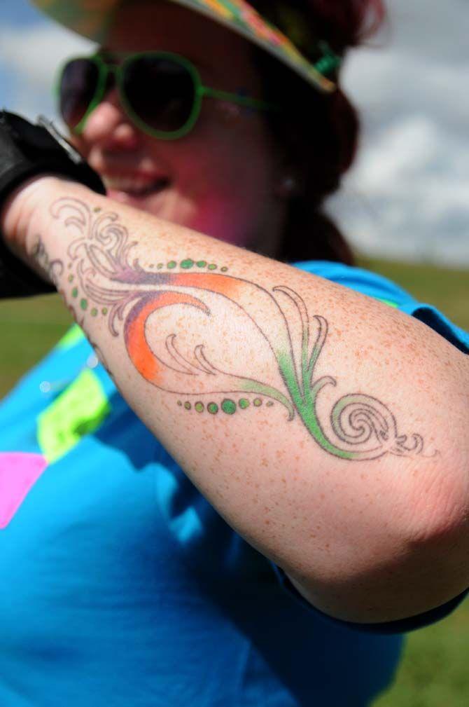 "BeYOUtiful" team captain, Kelly Boffone, diplays her National Eating Disorder Association (NEDA) tattoo at the NEDA walk at the Riverfront Plaza on October 11, 2014