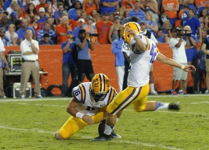 LSU sophomore placekicker Colby Delahoussaye (42) kicks the ball for an extra point Saturday, October 11, 2014 during the Tigers' 30-27 victory in Ben Hill Griffin Stadium.