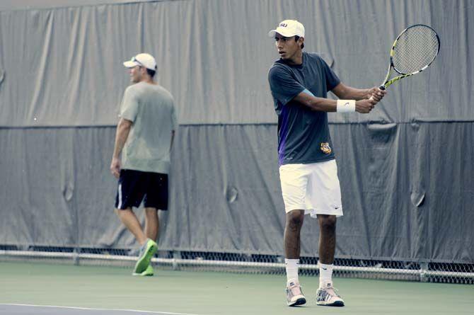 Junior Boris Arias volleys at practice on Thursday, September 11th, 2014.