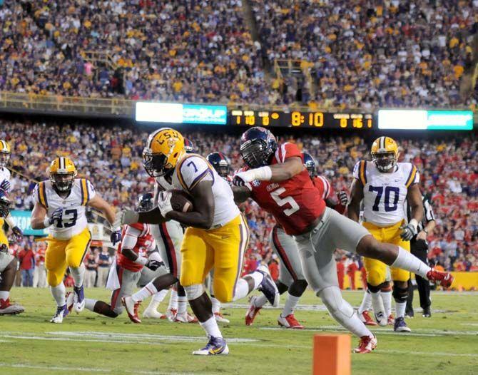 LSU freshman running back Leonard Fournette (7) escapes tackle from Ole Miss player in Tiger Stadium Saturday, October 25, 2014.