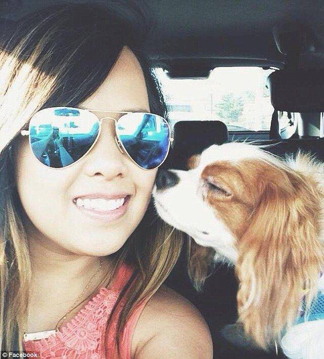 Nina Pham, 26-year-old Ebola virus patient, and her dog, Bentley, who was fought for by Pham's family and is now quarantined.