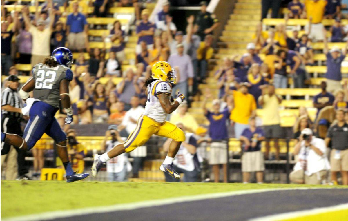 Senior running back Terrence Magee (18) runs for a touchdown during the Tigers' 42-3 win against Kentucky on Saturday, October 18th, 2014.