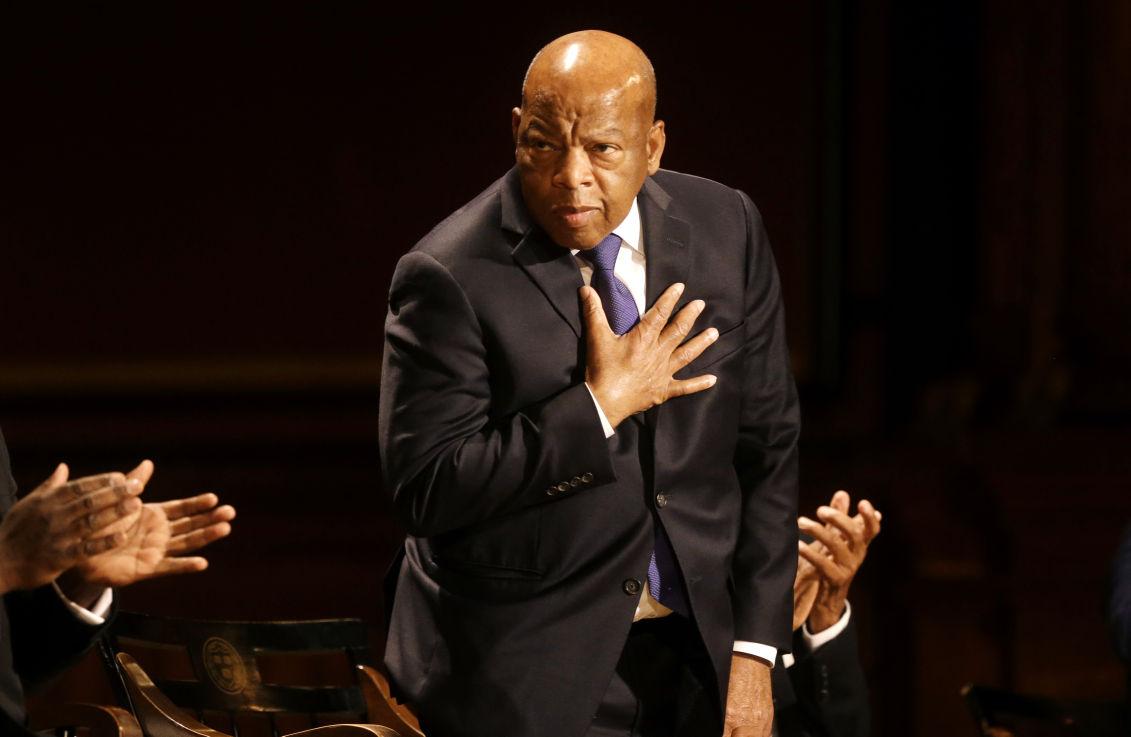 U.S. Rep. John Lewis, D-Ga., acknowledges applause during the W.E.B. Du Bois medal award ceremonies Tuesday, Sept. 30, 2014, on the campus of Harvard University, in Cambridge, Mass. The Du&#160;Bois Medal is Harvard's highest honor in the field of African and African American Studies. Lewis was presented with the medal during the ceremonies. (AP Photo/Steven Senne)