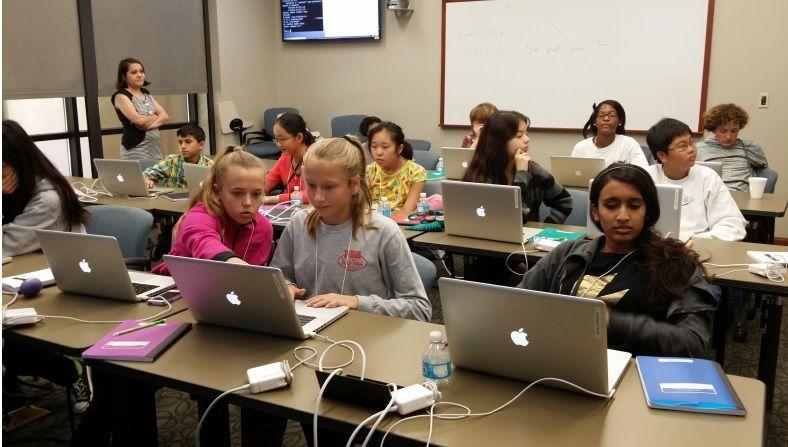 Middle school children work to teach computers how to add fractions at a Computing and Math Saturdays session. Credit: S. Renee Barrow (All children signed a photo waiver before attending.)&#160;