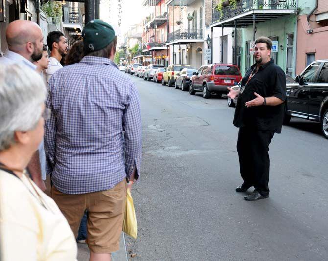 French Quarter Phantoms guide, Luke, shares old New Orleans legends and folklore of the city with tour participants.