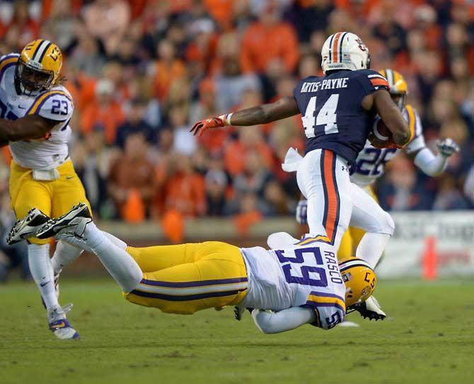 LSU senior defensive end Jermauria Rasco (59) attempts to tackle Auburn senior running back Cameron Artis-Payne (44) Saturday, October 4, 2014 during the LSU Tigers' 41-7 loss against the Auburn Tigers in Jordan-Hare Stadium.