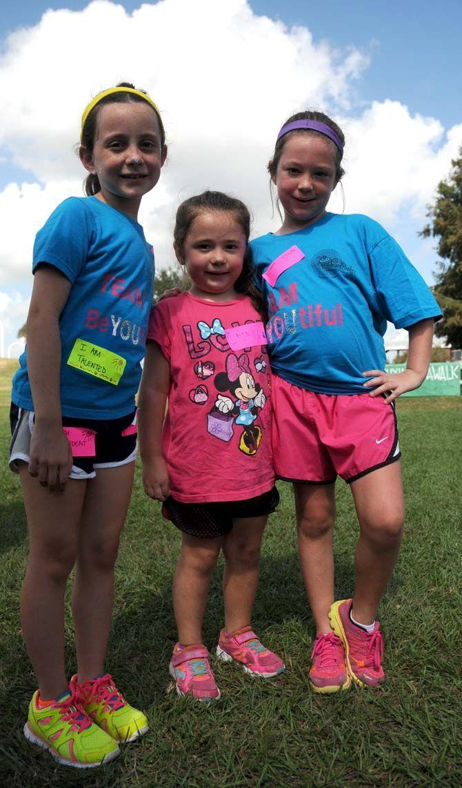 Young girls from team "BeYOUtiful" pose at the National Eating Disorder Association (NEDA) walk at the Riverfront Plaza on October 11, 2014