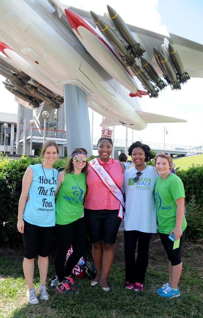 Kamah Asha Wilson (middle) from 2015 Our Little Miss World's Universal Girl poses with friends at the National Eating Disorder Association (NEDA) walk at the Riverfront Plaza on October 11, 2014