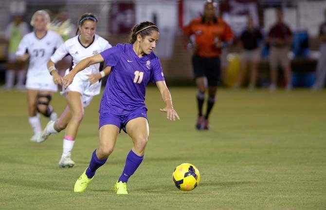 LSU junior midfielder Natalia Gomez-Junco (11) runs the ball Friday at LSU soccer stadium where LSU lost to Texas A&amp;M 4-1.