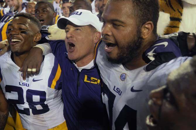 Les Miles celebrates his 100th victory as LSU football head coach Saturday, October 11, 2014 during the Tigers' 30-27 victory in Ben Hill Griffin Stadium.