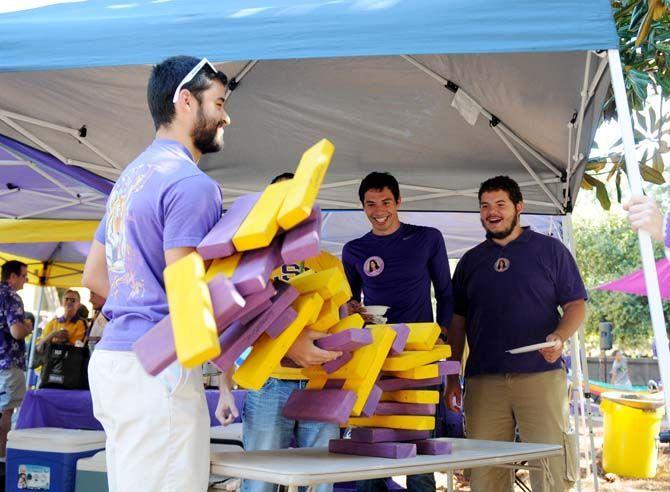 Fans play a game of Jenga during tailgate Saturday, October 25, 2014 before the LSU game against Ole Miss.