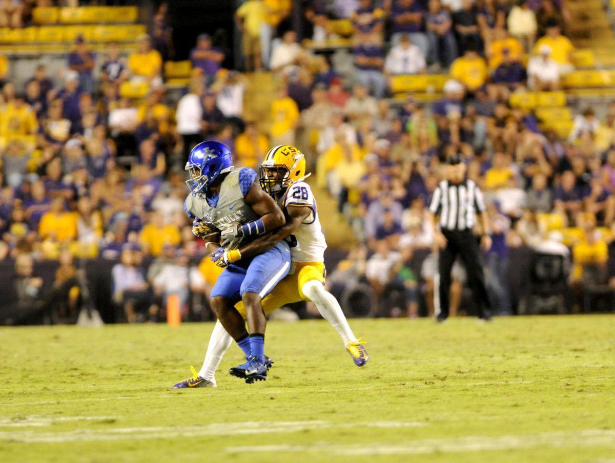 Junior defensive back Jalen Mills (28) makes a tackle during the Tigers' 42-3 victory against Kentucky on Saturday, October 18th, 2014.