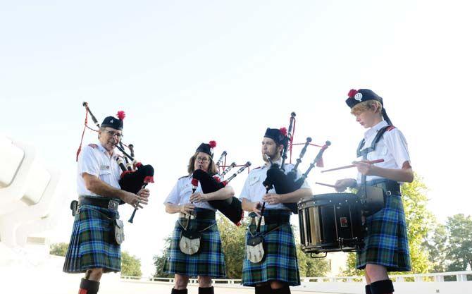 Members of the Baton Rouge Caledonian Pipes and Drums (left to right), Stan Masinter, Rosemary John, Thomas Martin and Ellis Jackson, perform Saturday, October 11 outside the PMAC.