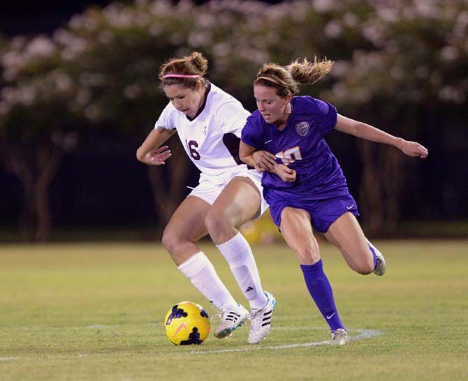 LSU sophomore midfielder Emma Fletcher (10) contends for the ball during Tigers' 1-4 defeat against Texas A&amp;M Friday, September 26, 2014 in LSU Soccer Stadium.